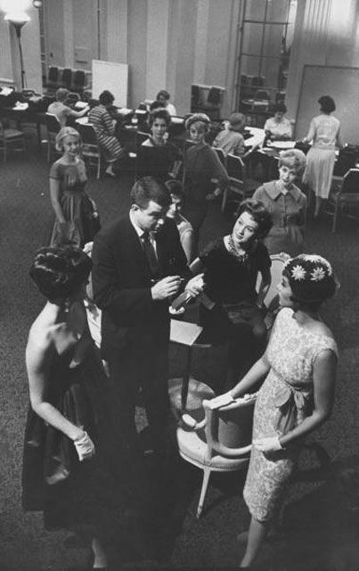 "Reporter Richard Cobb (C) talking with models at a fashion show at the Waldorf-Astoria hotel." 1958